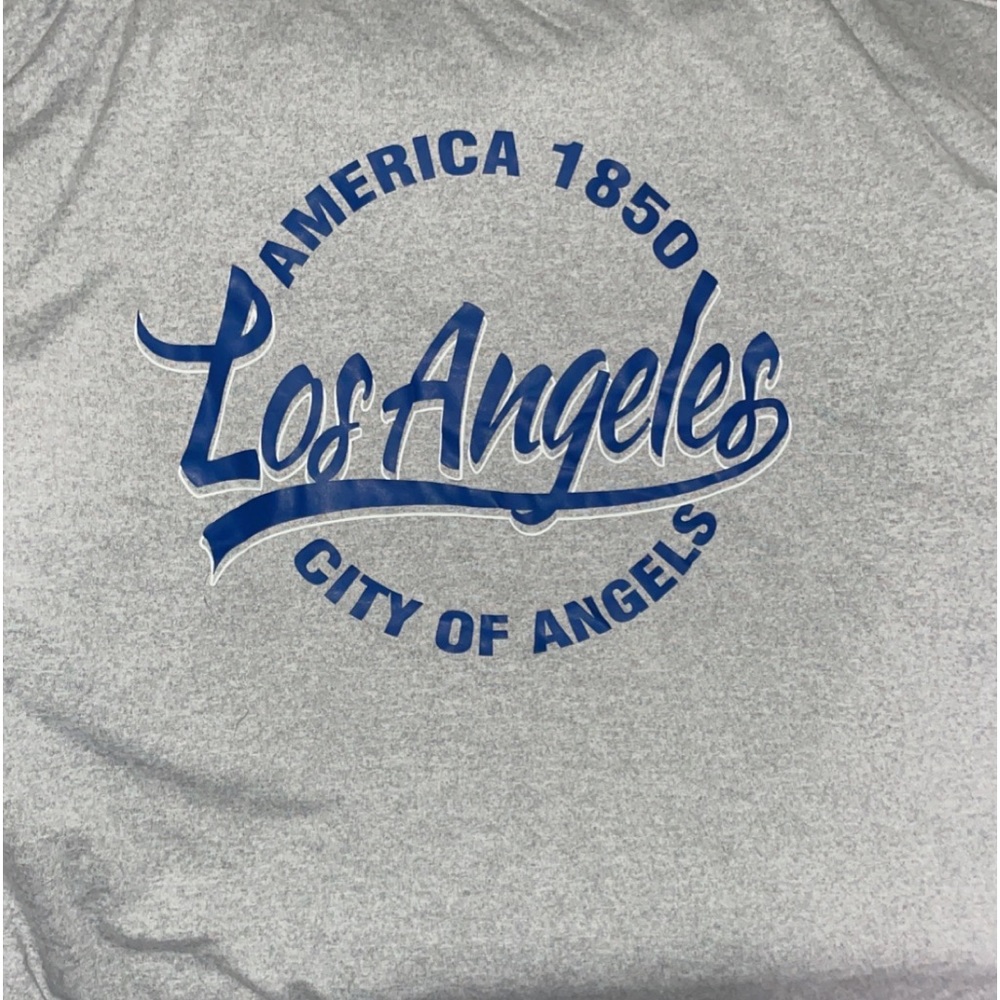 Brand new woman’s Tee size small but fits large